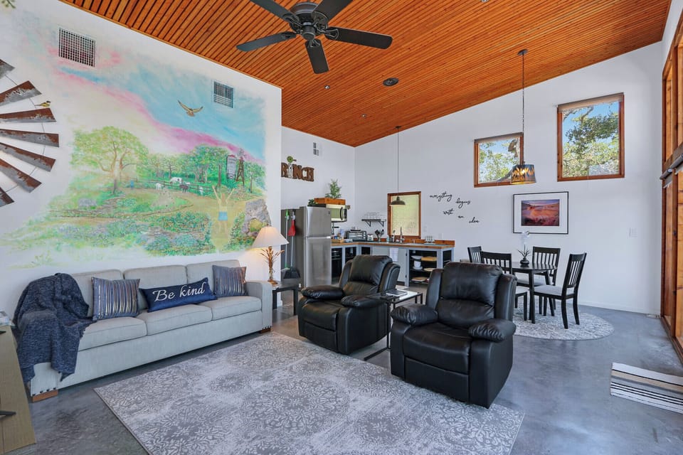 The living room features a queen sofa sleeper for additional guests.