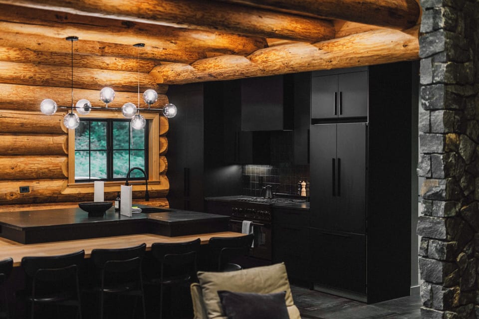 Prepare meals in the modern kitchen with sleek finishes and rustic charm.