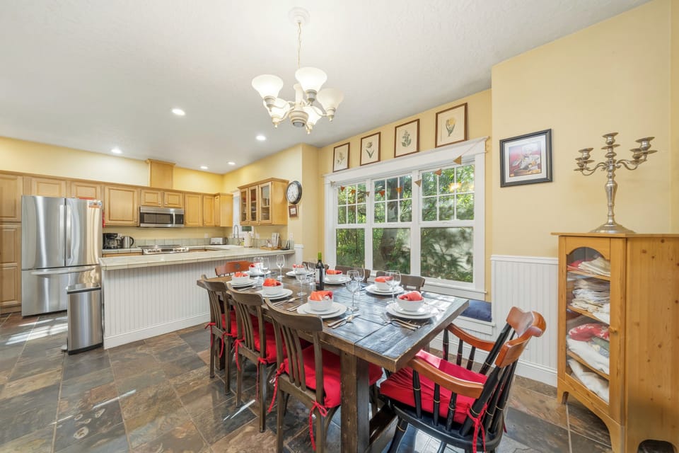 Open kitchen and dining area with double sided wood fireplace