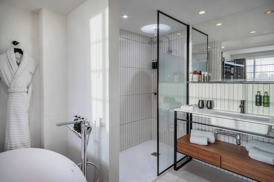 Designer toiletries, hair dryer, bathrobes, slippers