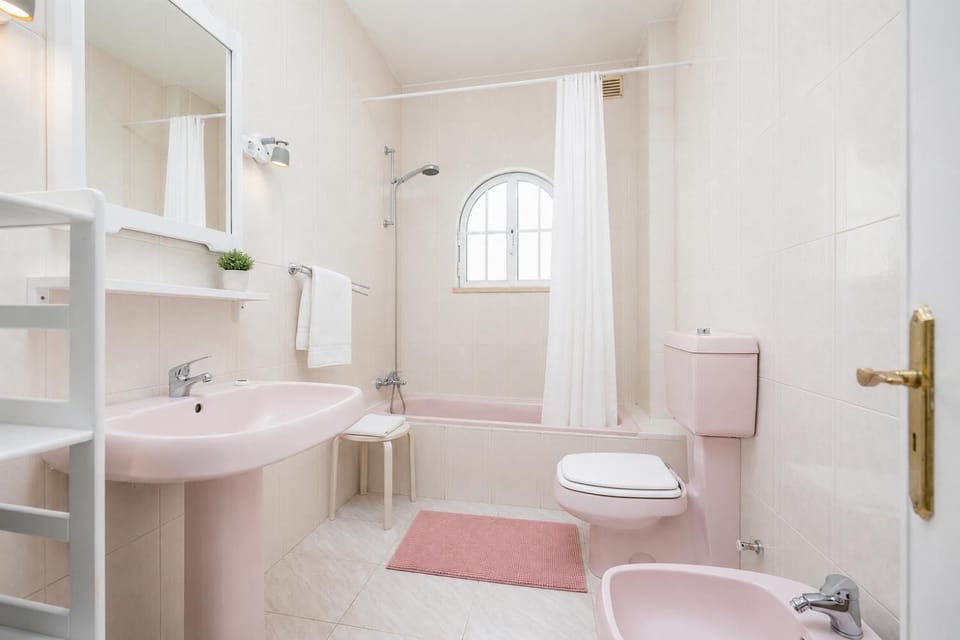 Family bathroom with bath and shower