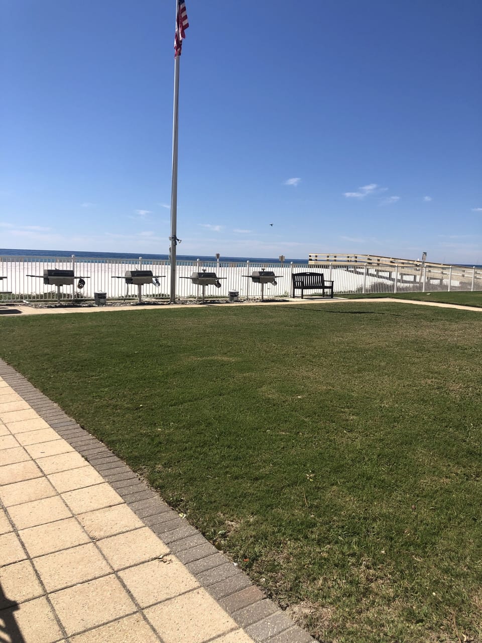 Green space with charcoal grills over-looking the beach and Gulf of Mexico. 