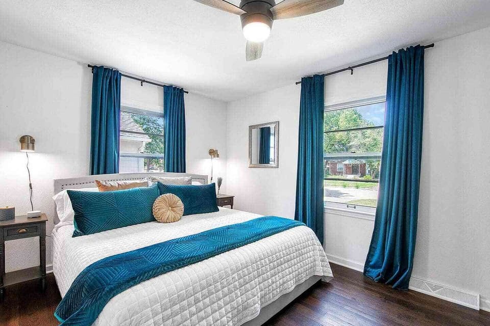 Upstairs Bedroom with Cozy Hybrid King Size Bed, Black out shades and curtains and Smart TV.