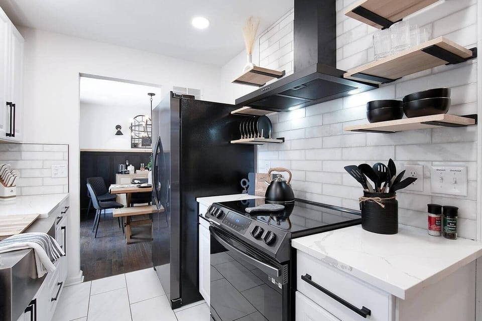 Remodeled Kitchen with Quartz Countertops, Marble Backsplash, Plenty of storage Space with open shelves and cabinets.  Small appliances included.