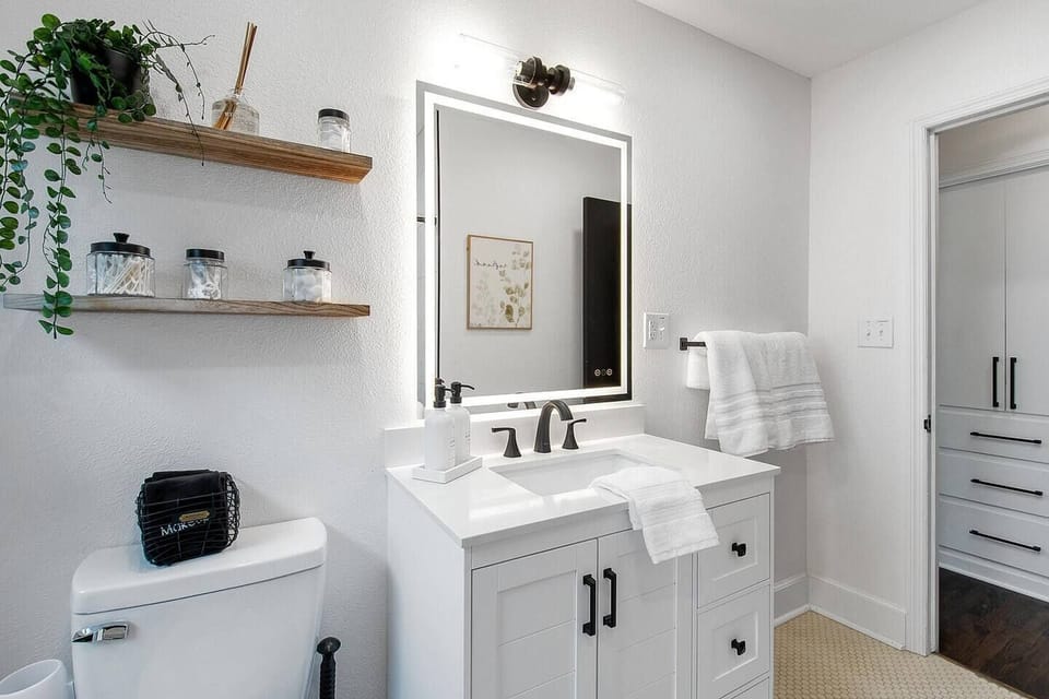 Remodeled Bathroom with Lighted Mirror.