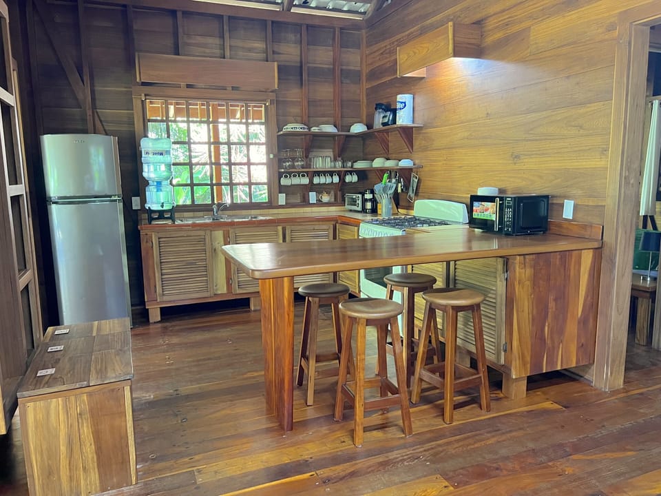 Standard Bungalow | Private kitchen | Highchair, cleaning supplies, paper towels