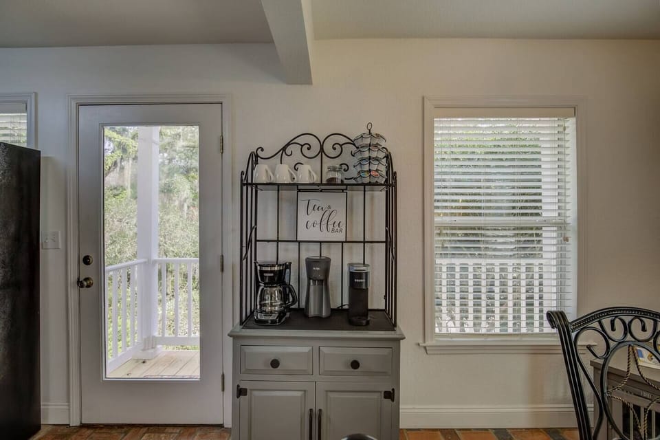 Start every morning here — your dedicated coffee and tea bar, then step straight outside to the river view.