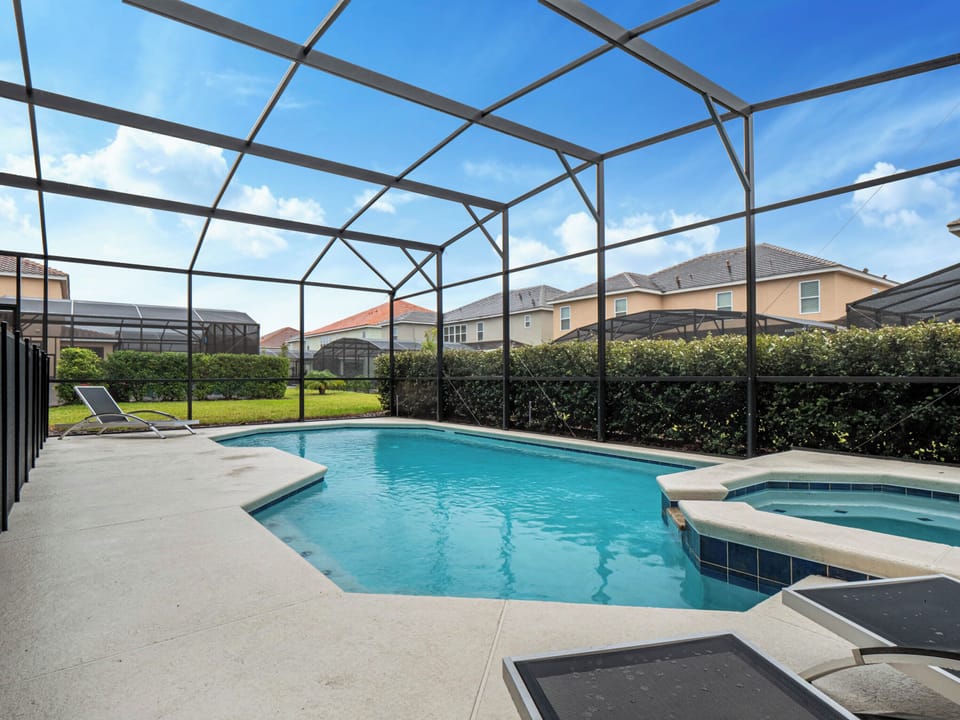 - Private screened pool with spa and sun loungers nearby  
- Spacious patio with seating for relaxing under the sky  
- Refreshing outdoor area perfect for day and night swims