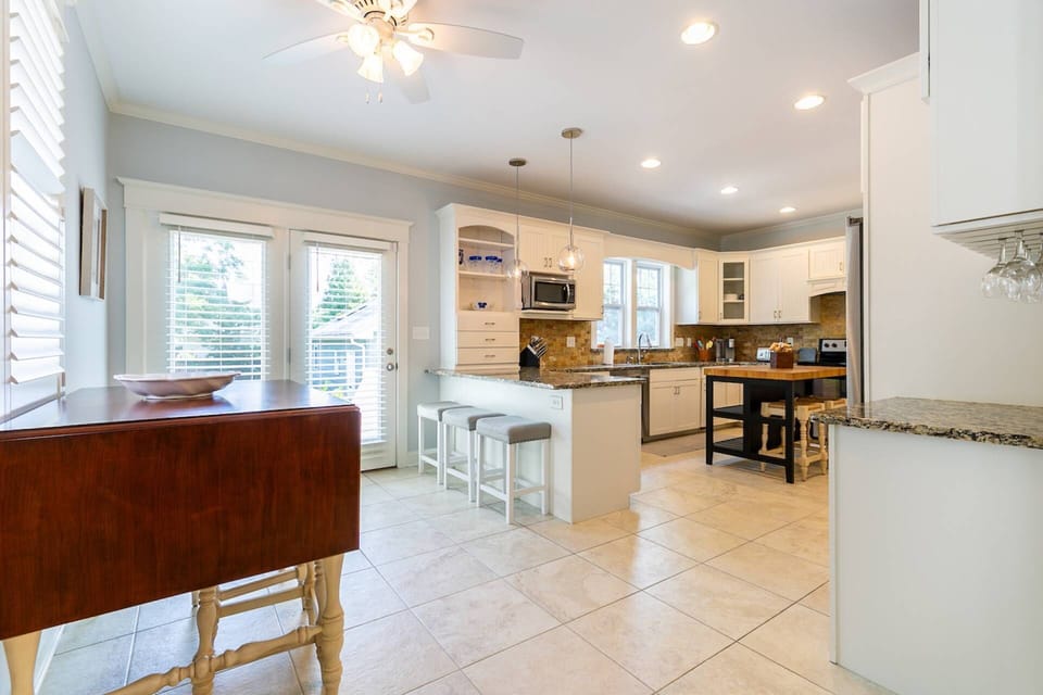 The private backyard is accessible from the French doors in the kitchen.