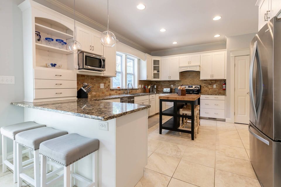 The recently-renovated spacious gourmet kitchen is fully-stocked for your stay.