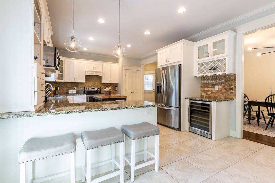 There is seating for 3 at the breakfast bar.  Don't forget to stock up on your favorites in the beverage cooler.