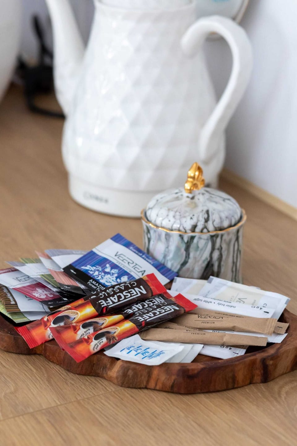 A close-up showing coffee and tea prepared for the arrival of guests.
