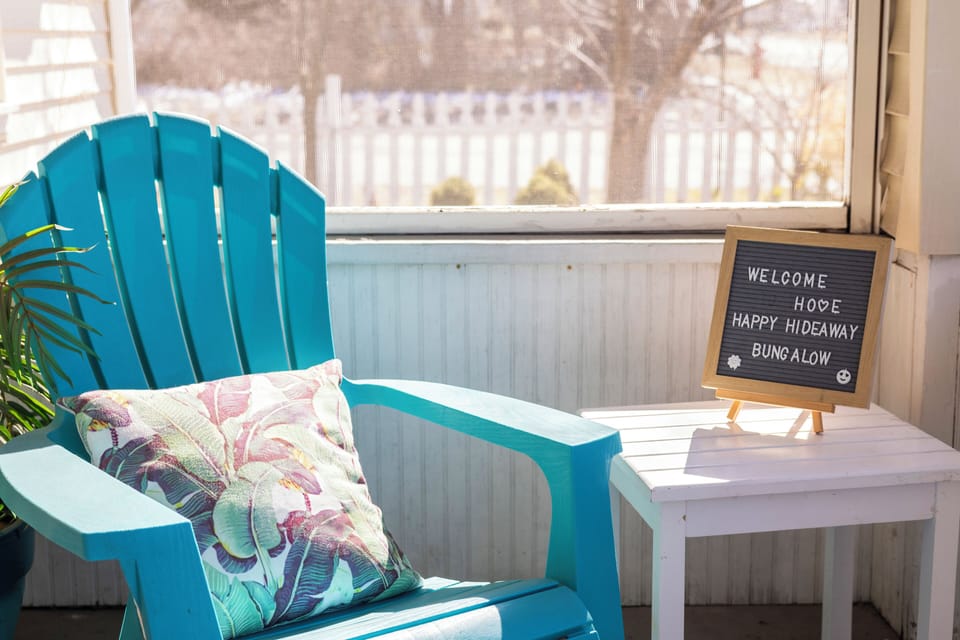 Charming screen porch at the front of the home