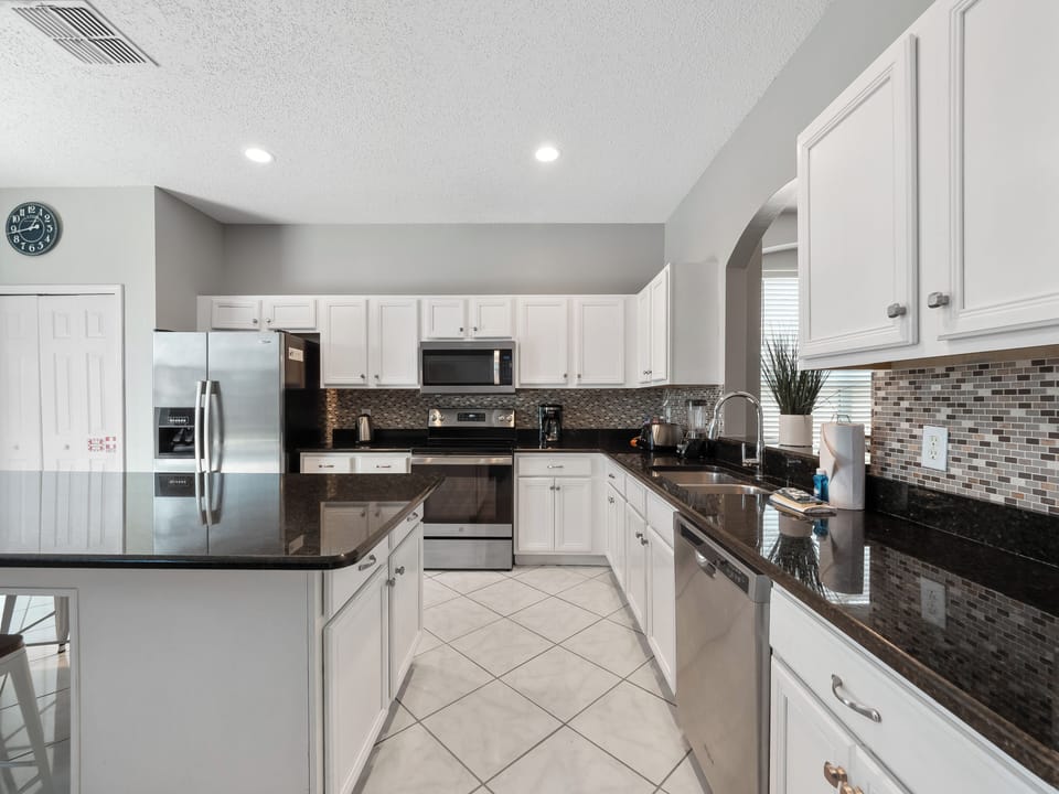 Spacious Full Size Modern Kitchen with Bar Stool Seating
