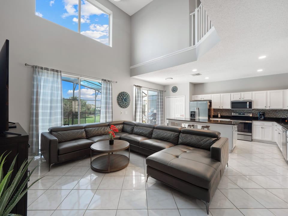 Gorgeous Downstairs Living Area with Comfortable Seating and Flat Screen TV