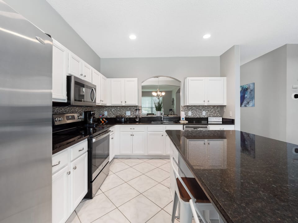 Spacious Full Size Modern Kitchen with Bar Stool Seating