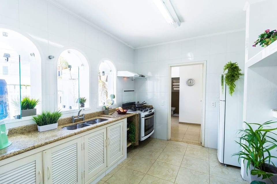 Villa | Private kitchen | Fridge, microwave, oven, blender