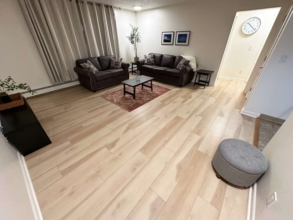 Living Room and Entry to Kitchen and Hallway to Bathroom and Bedrooms