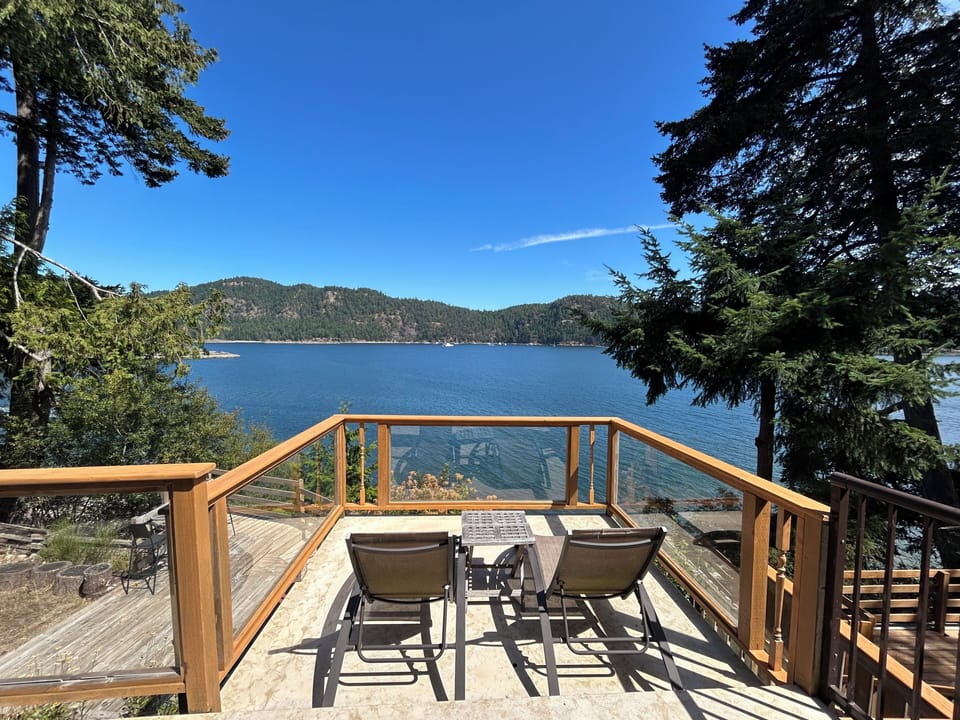 Private waterfront deck — a peaceful spot for coffee, dining or relaxing.