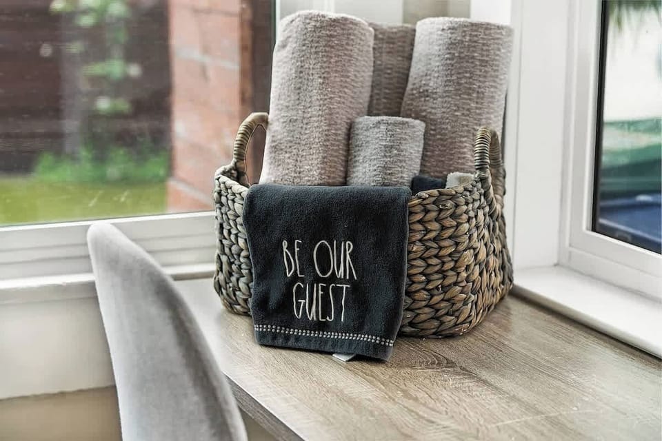 Welcome basket with plush towels on the sill—thoughtful host touches for a comfortable North Park stay