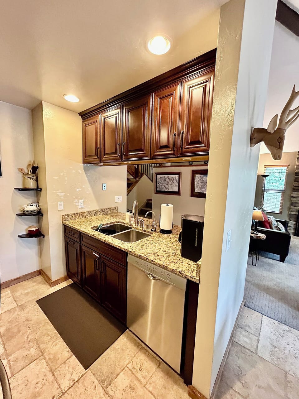 Kitchen pass thru and stainless steel dishwasher.