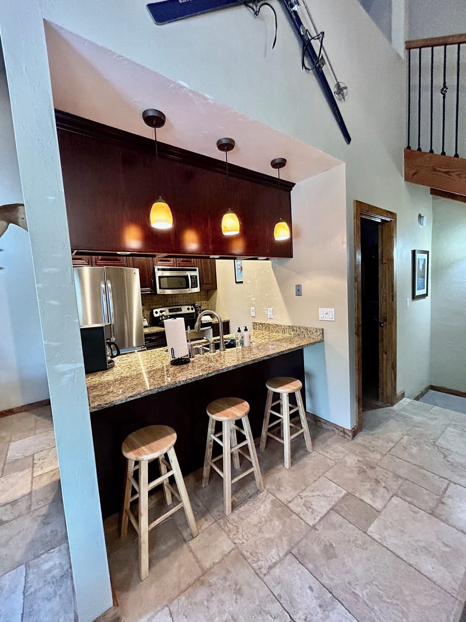 Up on mid level you will find breakfast seating with open pass thru from kitchen