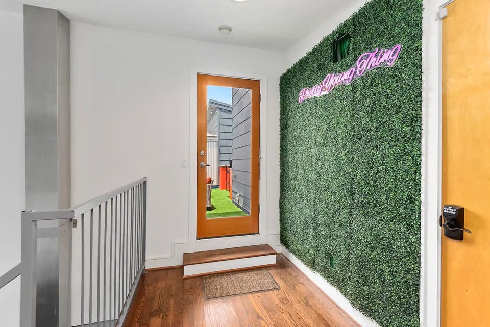 Exit to 4th Floor Patio; Hedge Wall