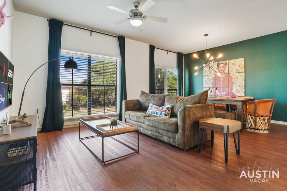 Large open living room with smart tv and dining