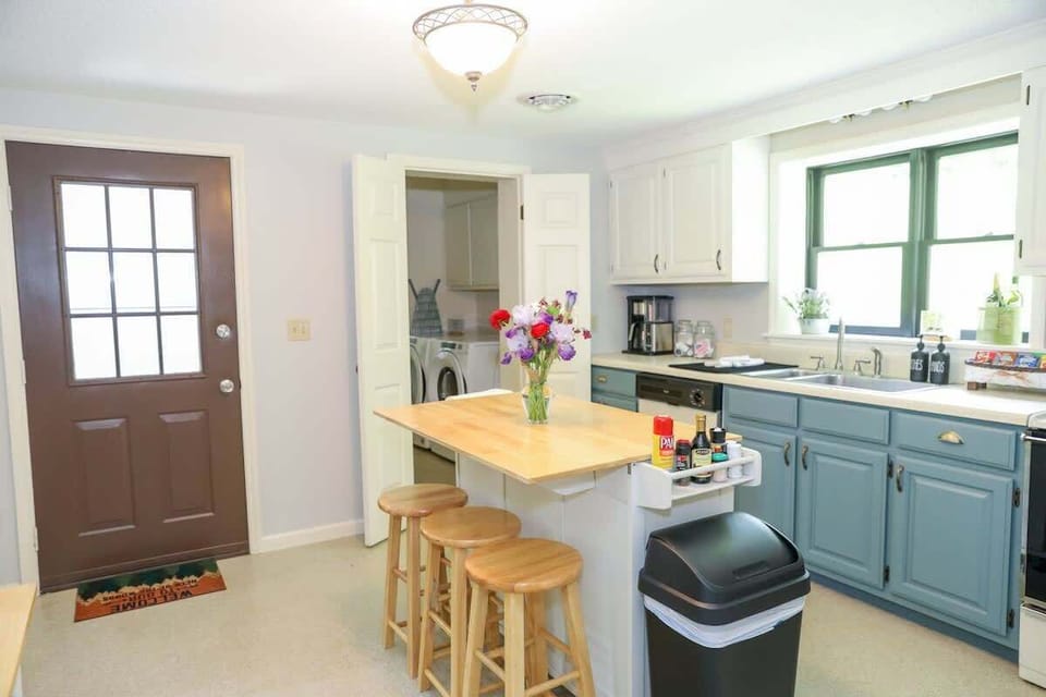 Kitchen -- outside entrance and entrance into laundry and bath