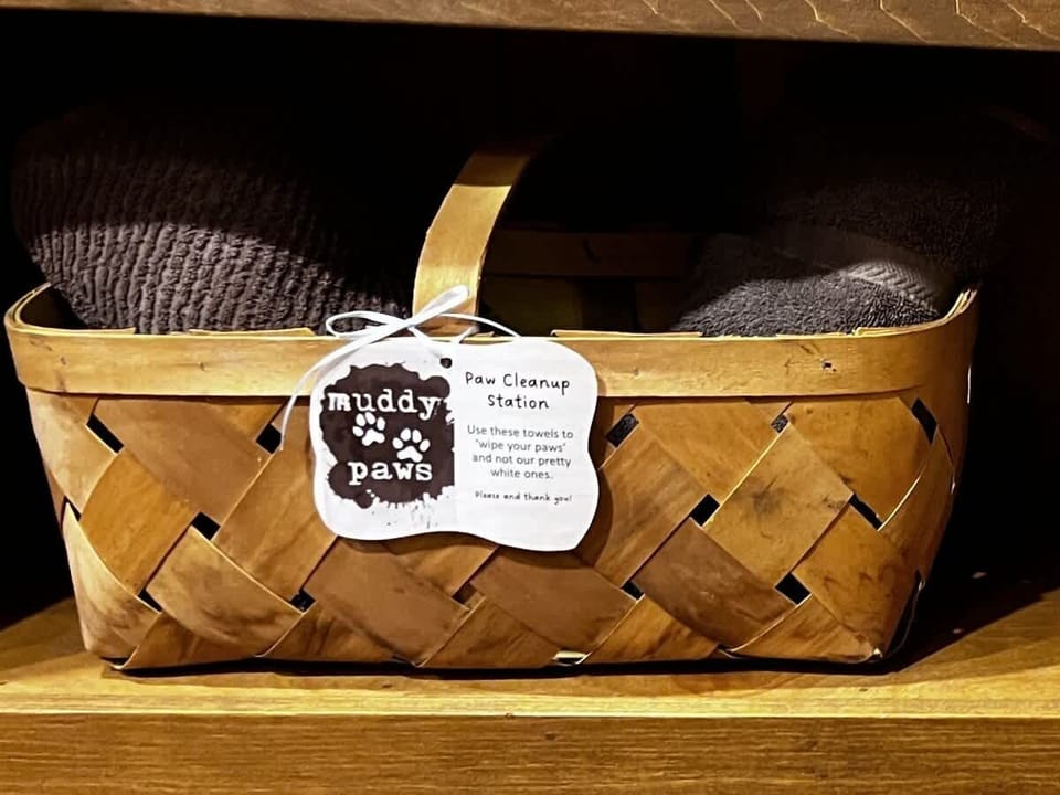 Pup station -- includes towels for muddy paws, our policy and a few toys