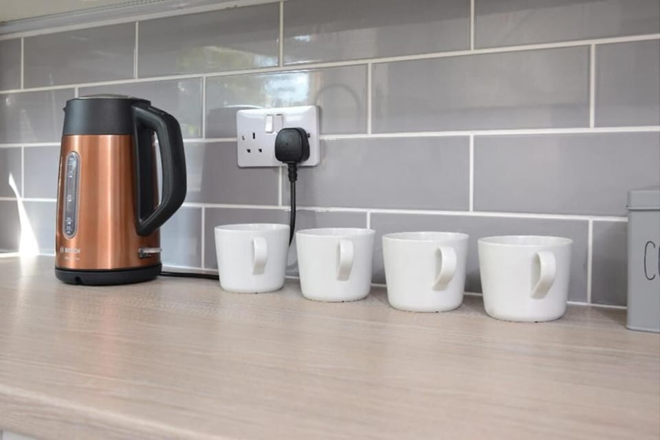 Enjoy hot beverages anytime with our convenient water heater and cups