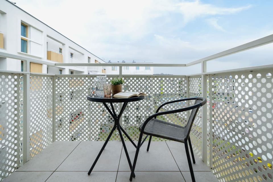 The balcony showing its stylish setup and a beautiful view of the courtyard below.


