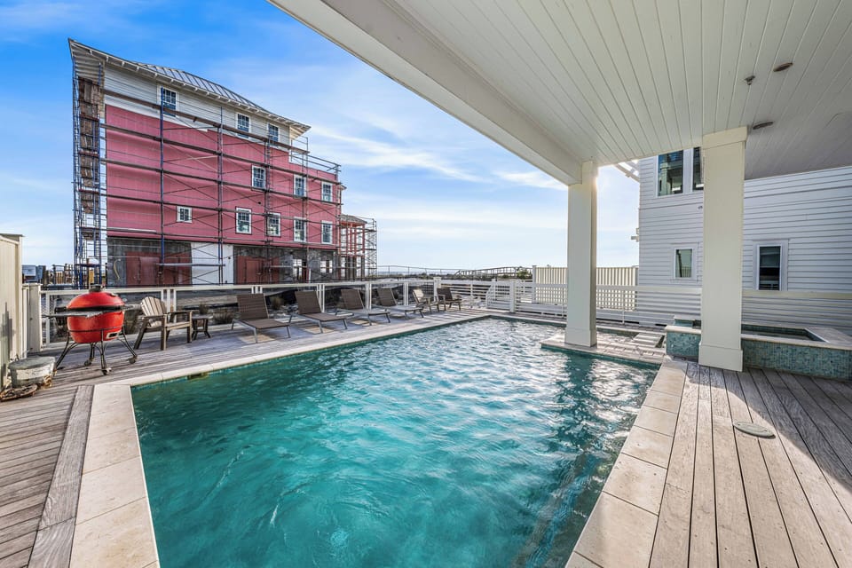 Enjoy the views from the pool deck, where a BBQ grill and lounge chairs await for a relaxing afternoon