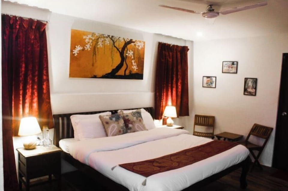 Desk, iron/ironing board, bed sheets