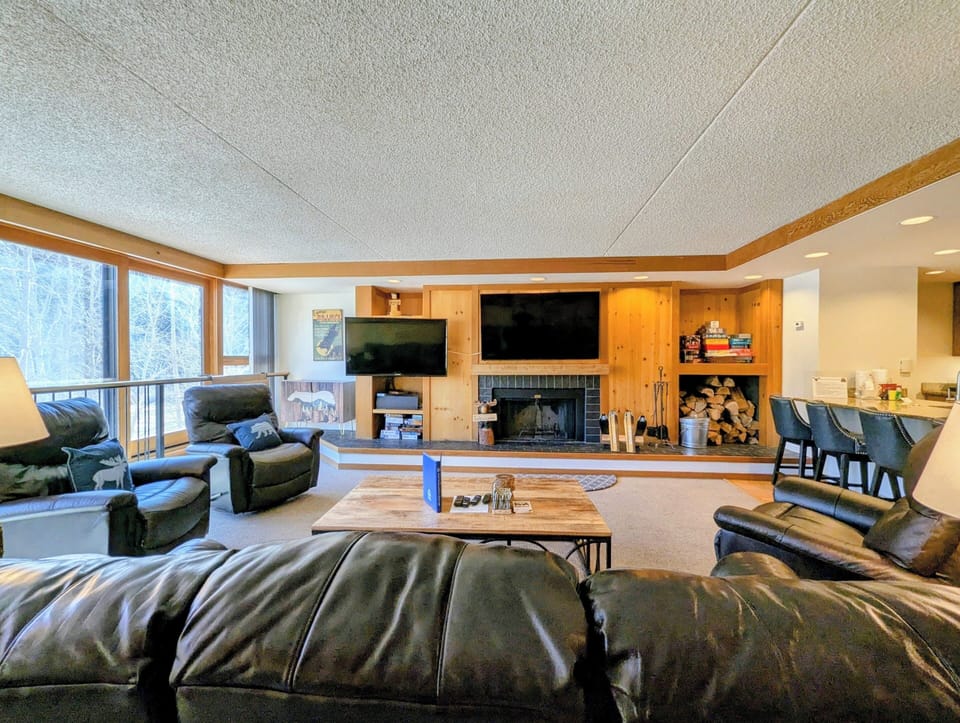 Cozy up by the electric fireplace and watch your favorite program!