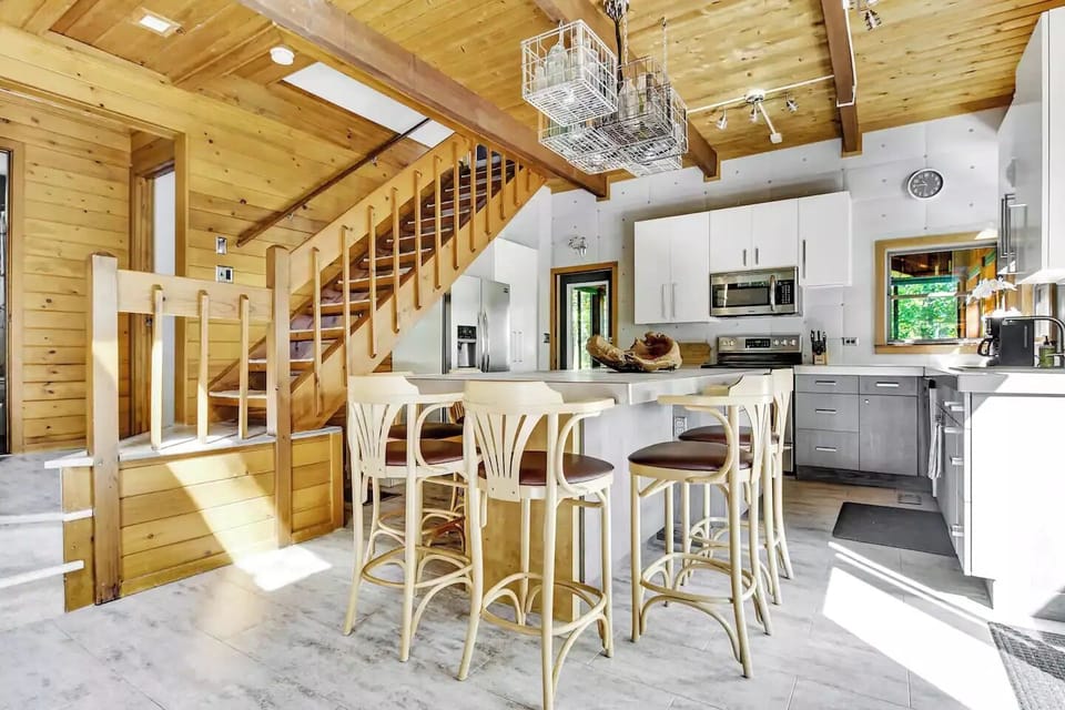 A large island for prep and dining and fully equipped kitchen.