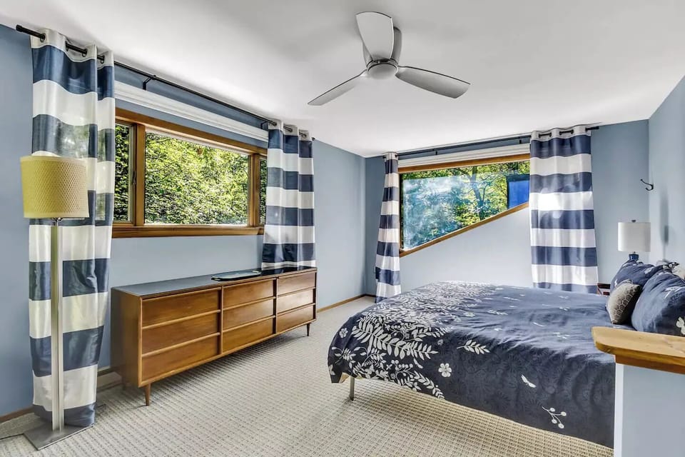 Large, light-filled master bedroom on second floor with king-size bed.