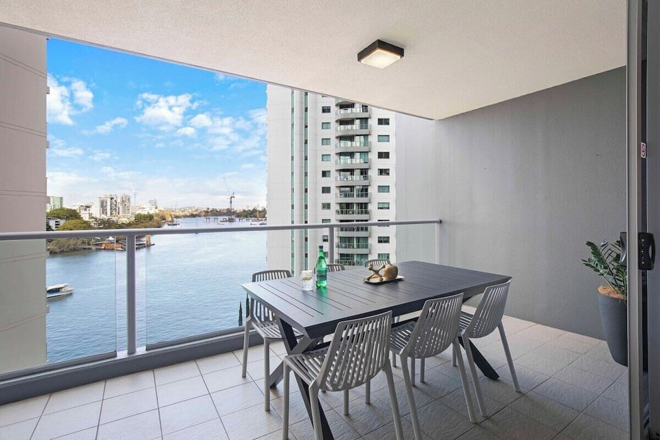 Alfresco dining with river and city views.