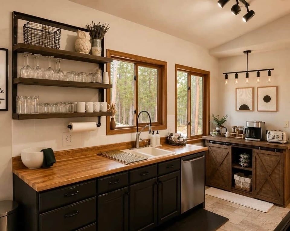 ☕ Fully stocked coffee bar, dishwasher, and forest views from the kitchen
