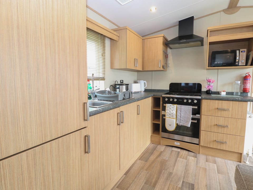 Fridge, electric kettle, toaster, cookware/dishes/utensils