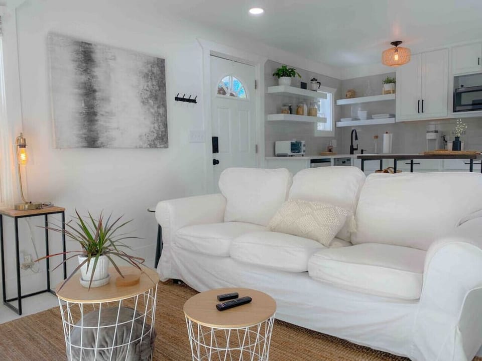Bright white living area with plenty of room for a cozy stay!