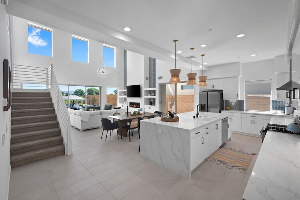 Expansive open-concept layout w/ kitchen, dining & living areas seamlessly connected