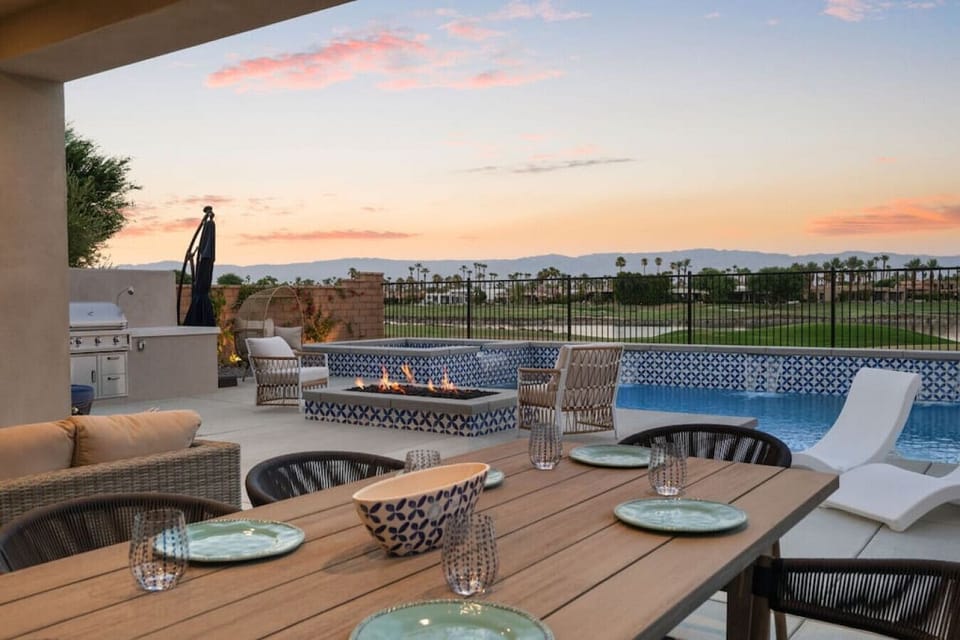 Outdoor dining patio w/ pool, firepit & sweeping sunset views for memorable evenings