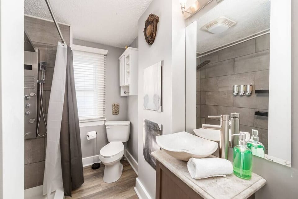 Use the shower jets in your upstairs full BA to wash away that northern grime. Tiled shower.