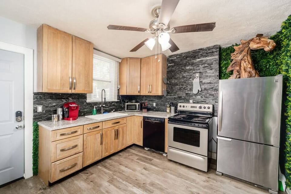 Your chef's kitchen includes SS appliances, granite countertops, a marble island, and Keurig