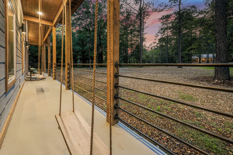 Discover seating on the front porch, where a couple of swings are a fun and relaxing touch.