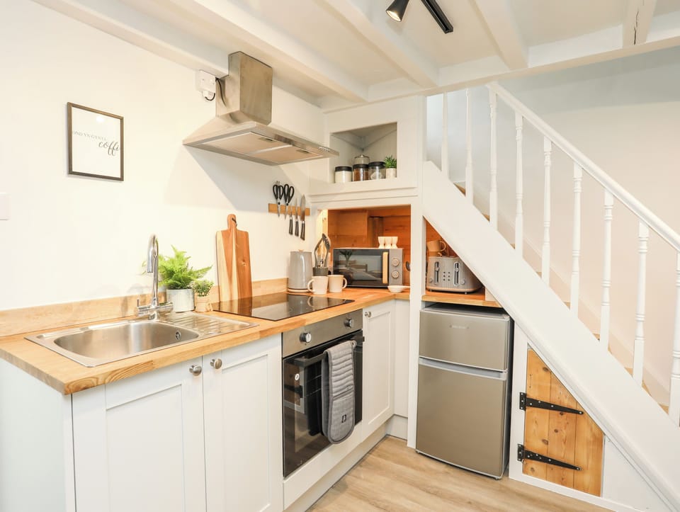 Fridge, electric kettle, toaster, cookware/dishes/utensils