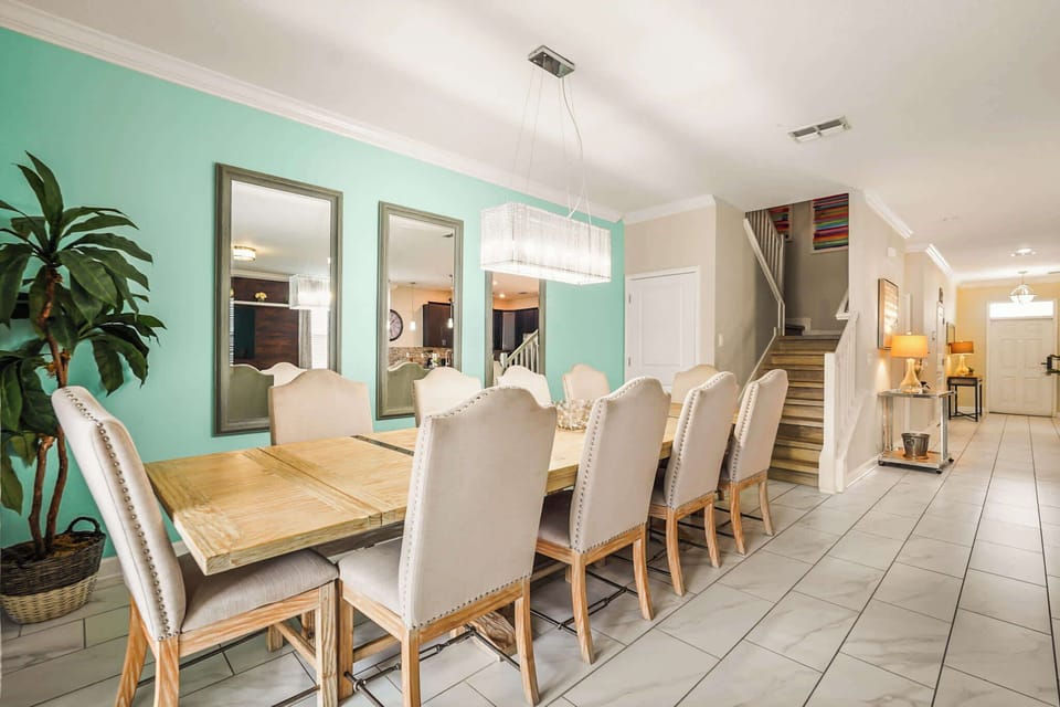 Elegant dining room with seating for ten, perfect for gatherings and celebrations in a stylish setting.