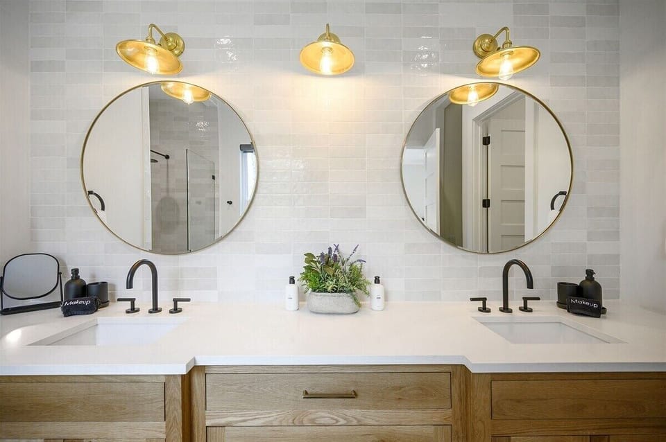 Master Bathroom: Double vanities and stylish mirrors create a serene space for self-care bliss!