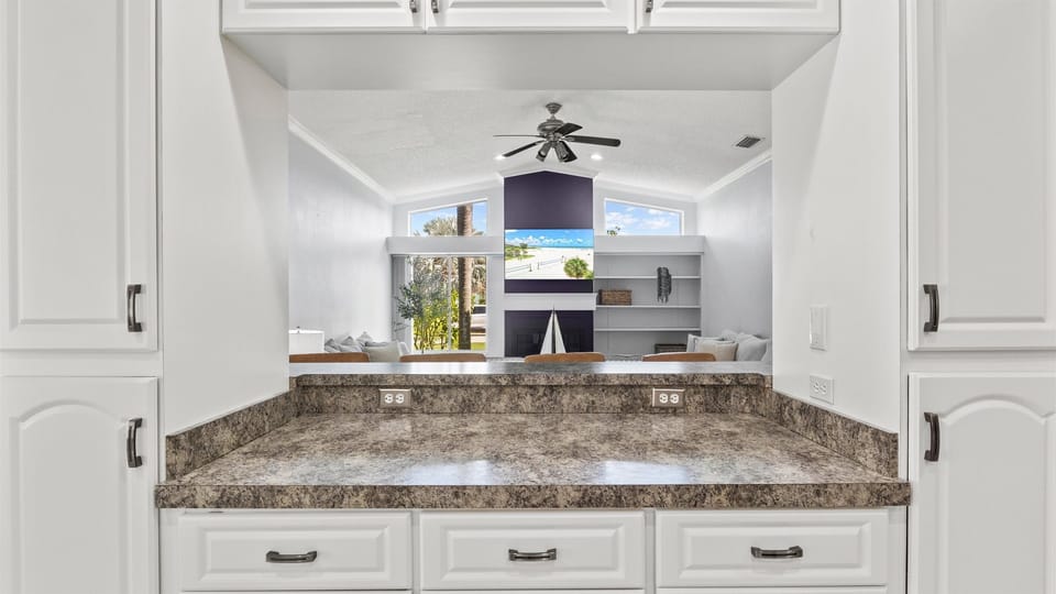 The kitchen island, opening up onto the living room